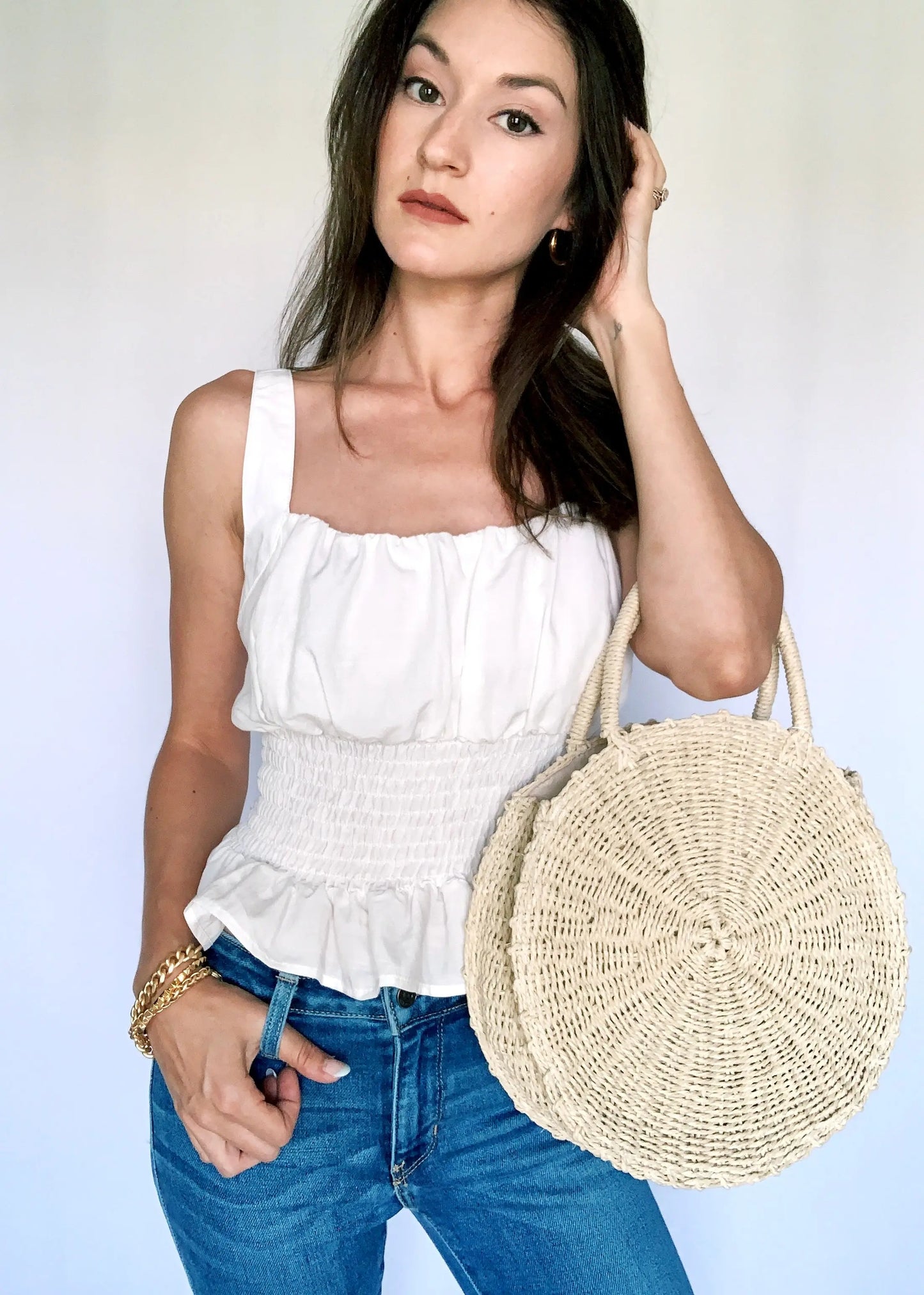 The Tiny Details Off White Sleeveless Smocked Peplum Top