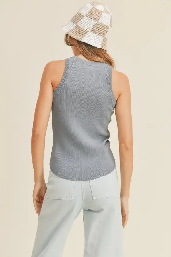 A women modeling a classic ribbed denim blue tank top