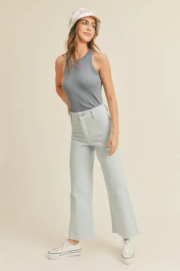 A women modeling a classic ribbed denim blue tank top