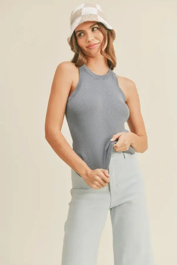 A women modeling a classic ribbed denim blue tank top