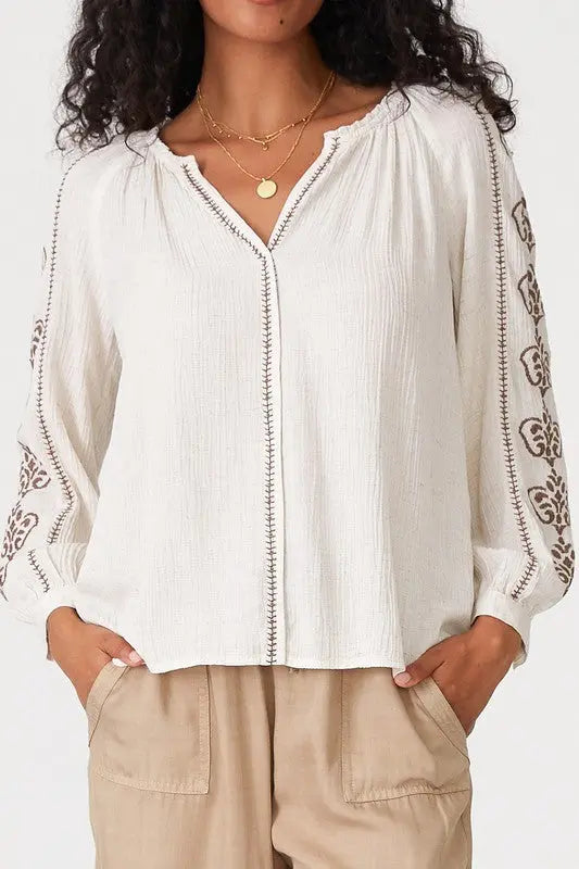 A female model showcasing a Embroidered Long Sleeve Boho Blouse