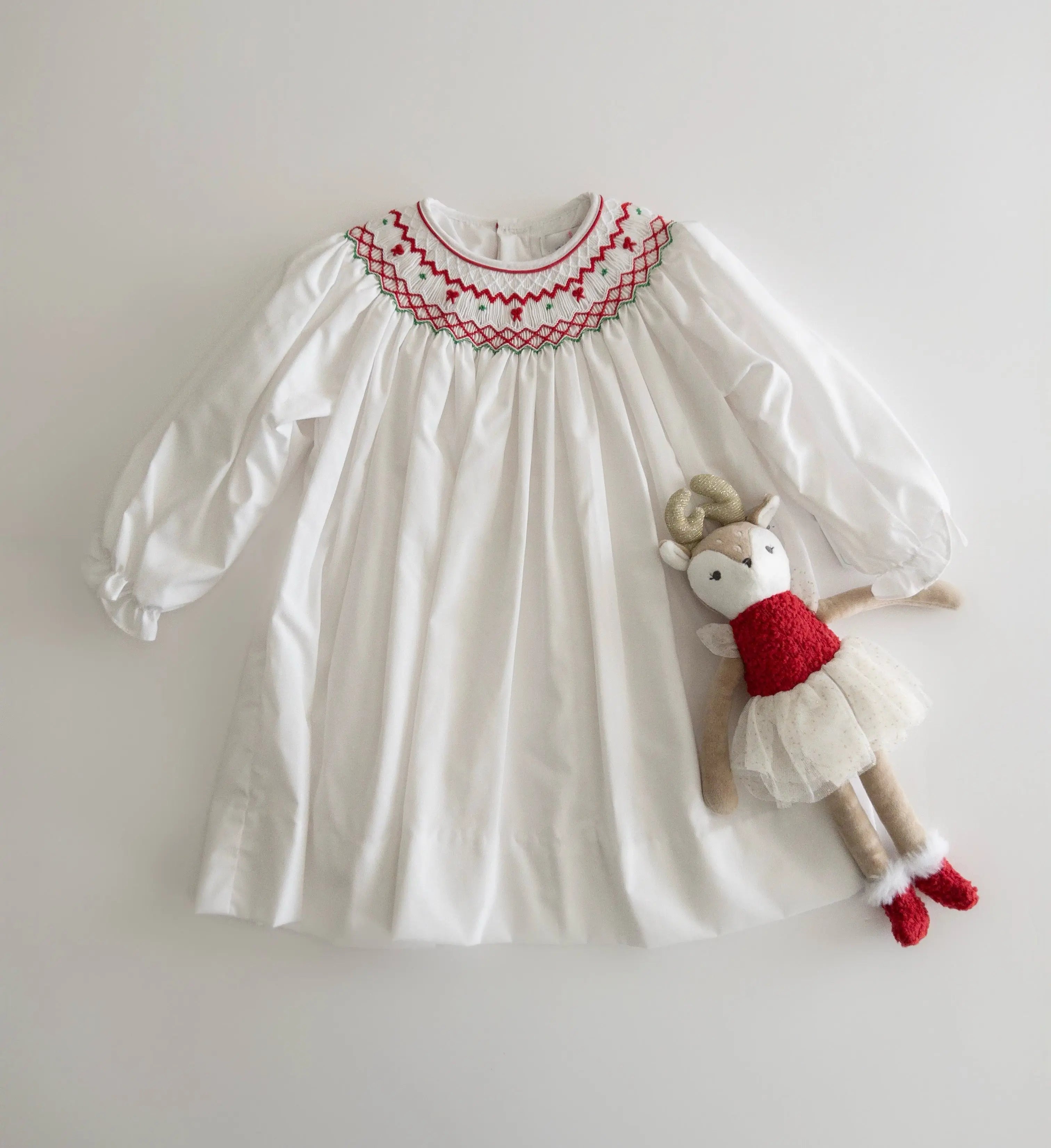 The Tiny Details Holiday Bishop Smocked Dress