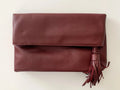 The Tiny Details Burgundy Smooth Folded Tassel Clutch