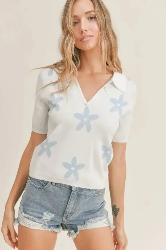 A female modeling the Coastal Cutie Sky Polo Sweater Top