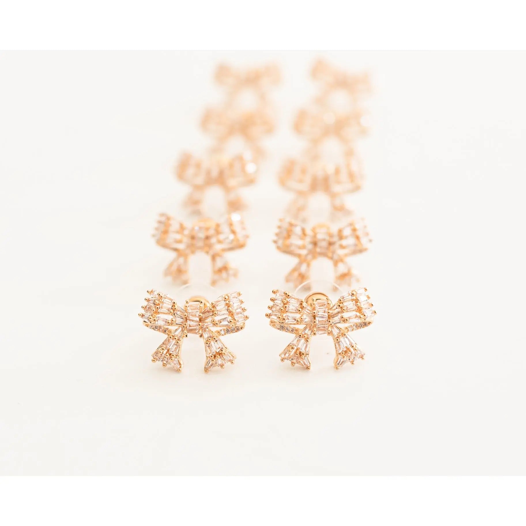 The Tiny Details Gold Mini Sparkler Bow Stud Earrings