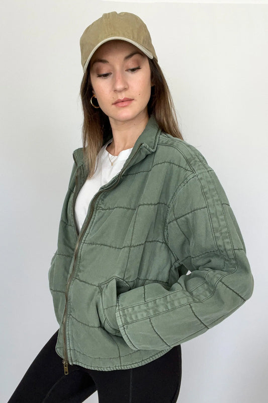 The Tiny Details modeling a Green Dolman Quilted Denim Jacket for women