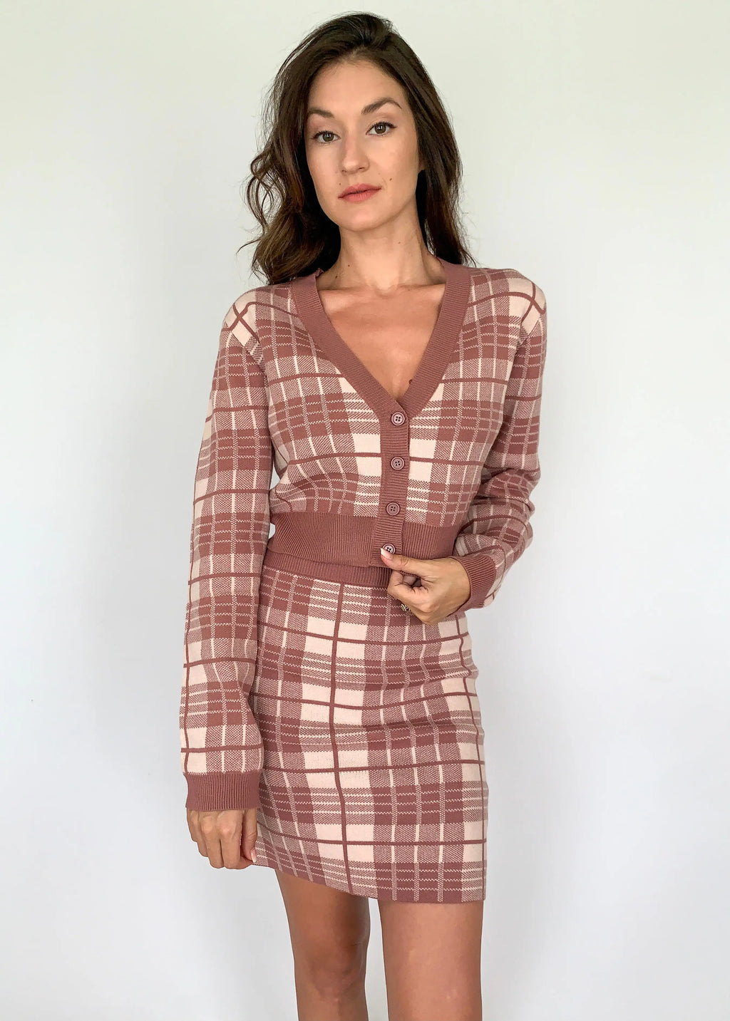 A model showcasing a mauve plaid knit elastic skirt for women