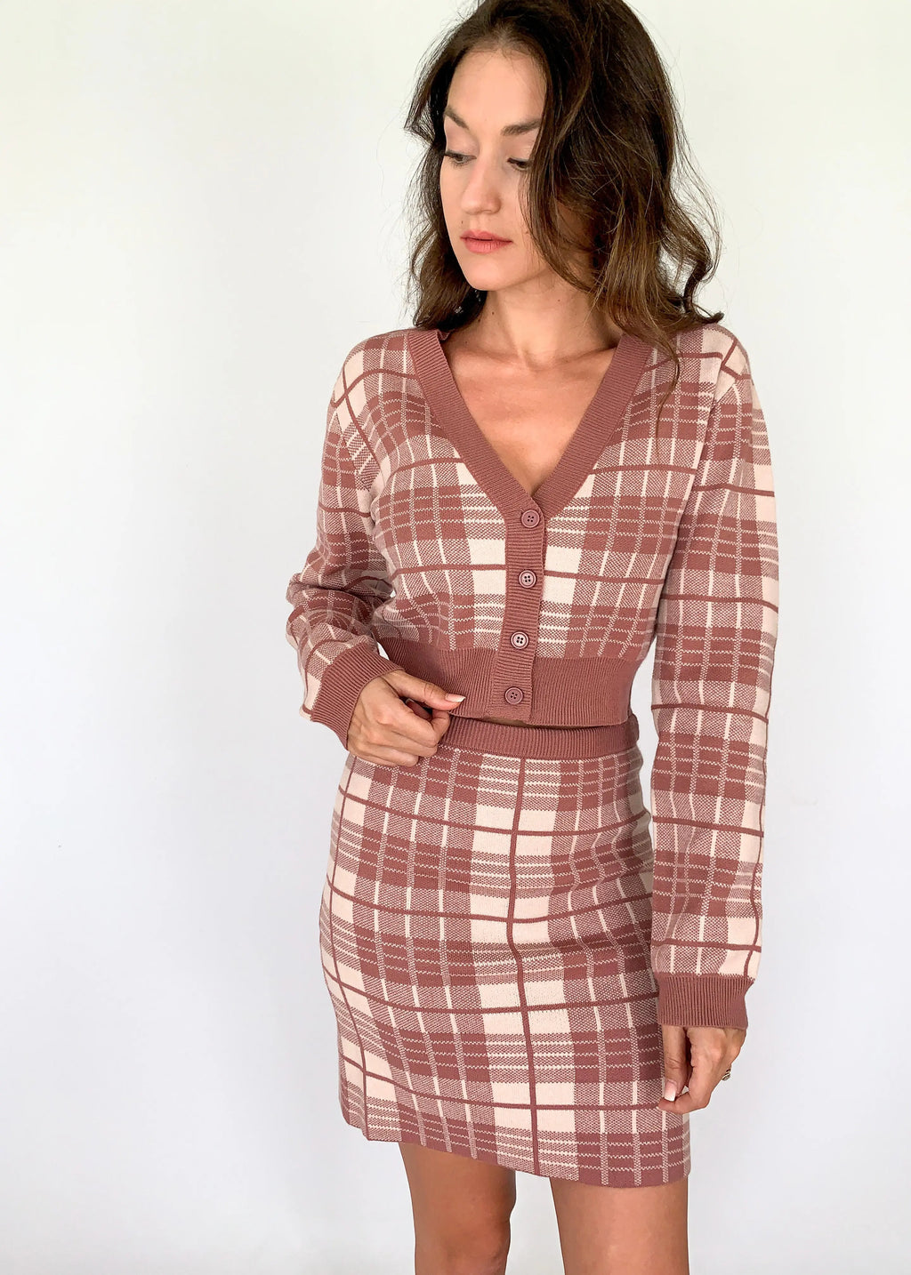 A model showcasing a mauve plaid knit elastic skirt for women