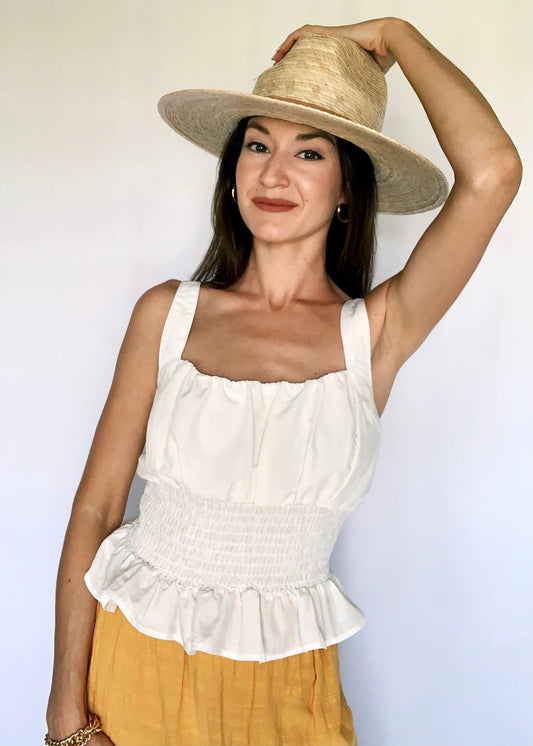 The Tiny Details Off White Sleeveless Smocked Peplum Top